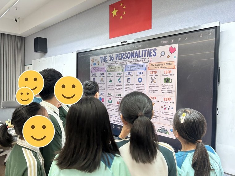 Students exploring personality types together on the whiteboard